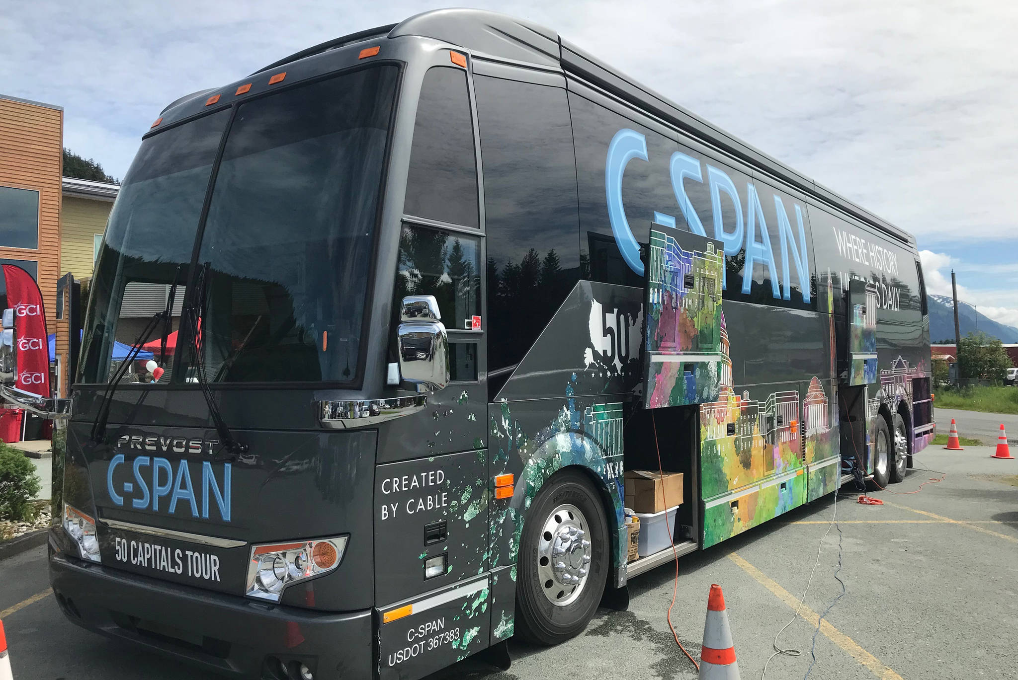 A C-SPAN bus that is visiting all 50 state capitals this summer sits in the parking lot of the GCI Store on Airport Boulevard on Monday, June 18, 2018. Juneau is the 38th stop for the bus. (Alex McCarthy | Juneau Empire)