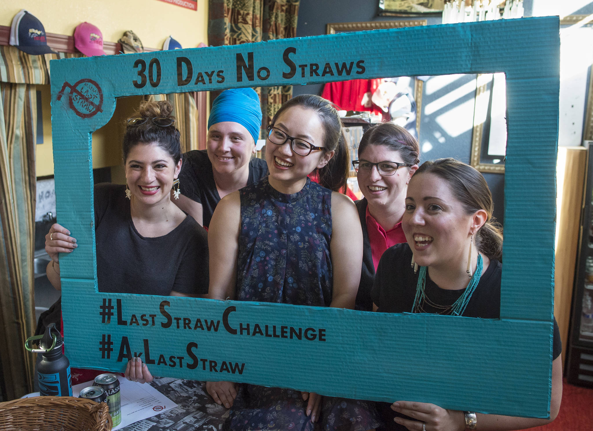 Meghan Chambers, left, Shabadrang Khalsa, Grace Lee, Stacy Katasse and Mary Richey, right, pose for a picture before a film against the use of plastic straws at the Gold Town Nickelodeon on Wednesday, June 20, 2018. (Michael Penn | Juneau Empire)