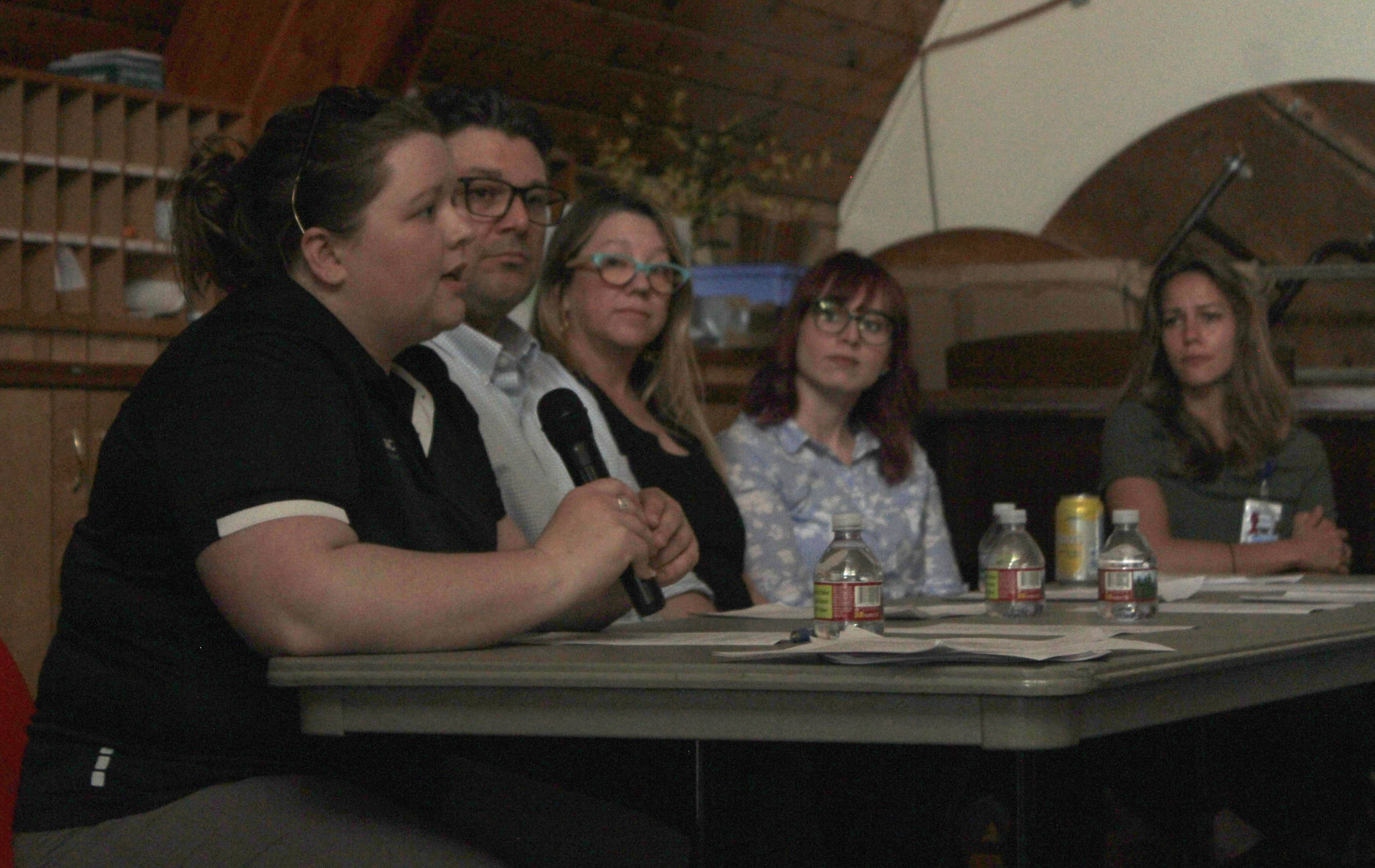 Sasha Moore, Healthcare for the Homeless clinic manager for Front Street Health Center, speaks at the Juneau Reentry Coalition meeting on Wednesday, June 21, 2018. Next to Moore, from left, are David Moore, a family nurse practitioner at Front Street Health Center; Meghan Lindquist, midtown primary care provider for JAMHI Health and Wellness, Inc.; Erin Maloney, behavioral health clinician for Bartlett Outpatient Psychiatric Services; and Claire Geldhof, nurse case manager at Bartlett Regional Hospital’s Emergency Department. (Alex McCarthy | Juneau Empire)