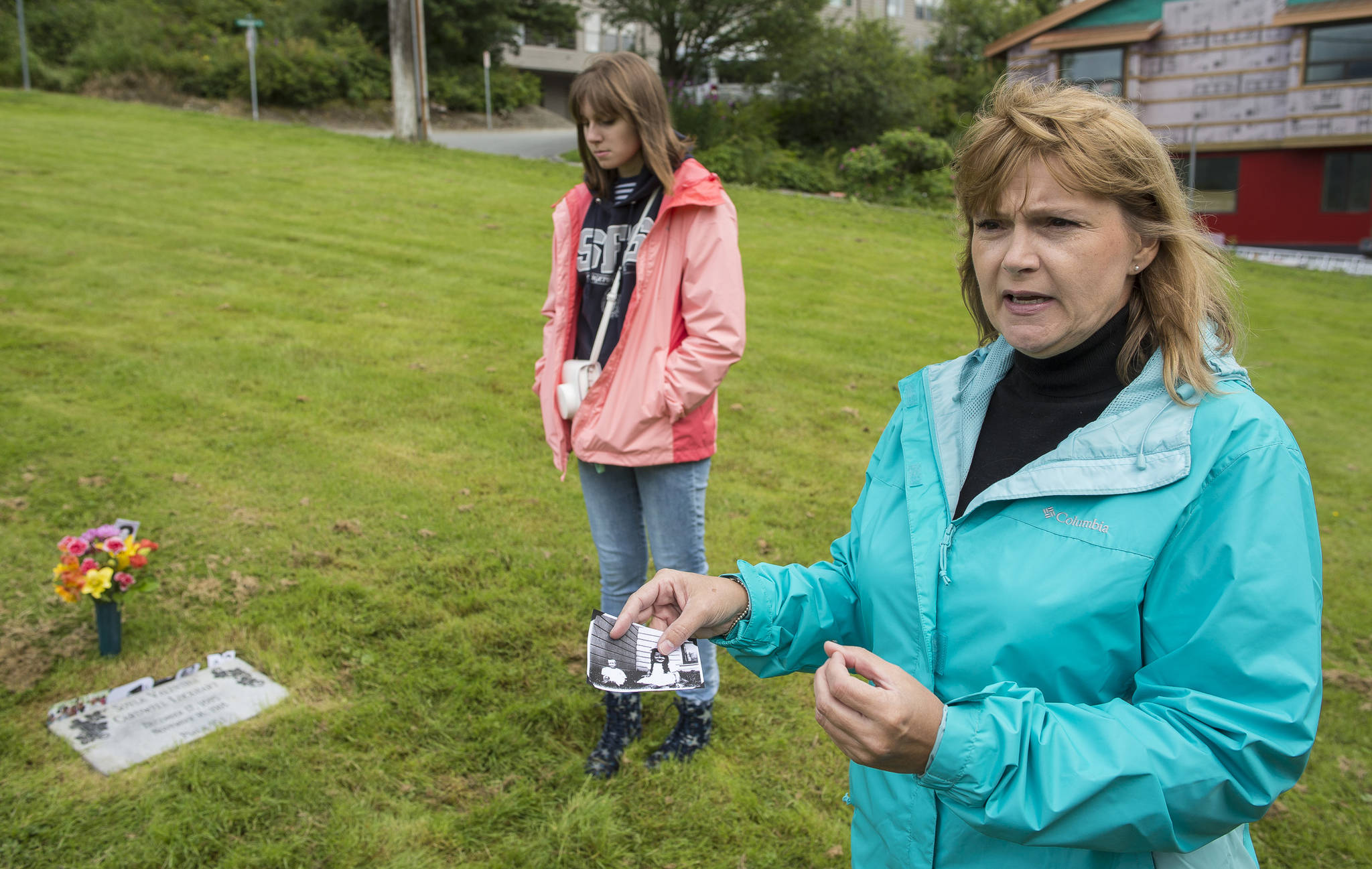 Paula Haug, of Folsom, California, and her daughter, Carlie, visit the grave of Haug’s great-grandmother Soyla Valentina Cardwell Lockhart on Tuesday, July 17, 2018. Cardwell died in Juneau in 1918. With the help of the folks at Evergreen Cemetery, she was able to track down where Lockhart was buried and place a stone on her previously unmarked grave. (Michael Penn | Juneau Empire)