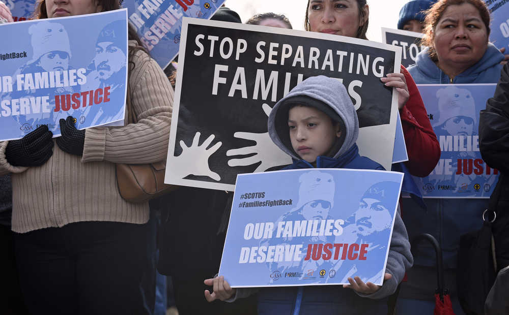 Members of CASA de Maryland participate in a immigration rally outside the Supreme Court in Washington, Friday, Jan. 15, 2016. The Supreme Court has agreed to an election-year review of President Barack Obama's plan to allow up to 5 million immigrants to "come out of the shadows" and work legally in the U.S. (AP Photo/Susan Walsh)