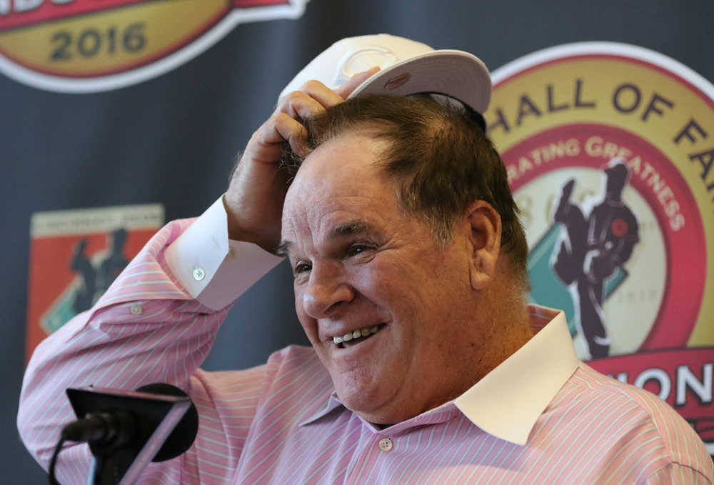 Former Cincinnati Reds player and manager Pete Rose laughs during a press conference where it was announced that he will be inducted into the Reds Hall of  Fame on Tuesday in Cincinnati.