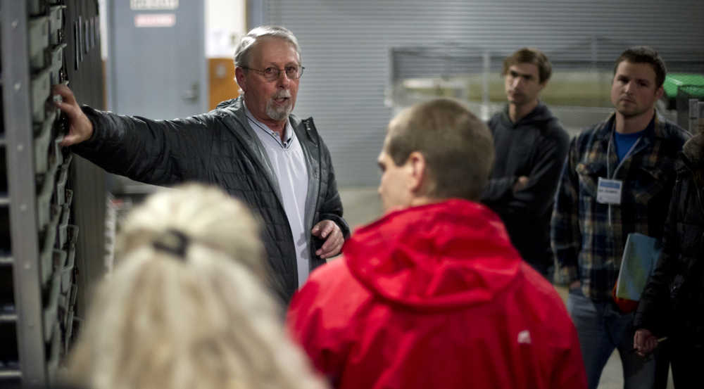 Eric Prestegard, executive director of Douglas Island Pink & Chum, Inc., leads a tour of the Macaulay Salmon Hatchery on Wednesday to people attending the Alaska Young Fishermen's Summit.