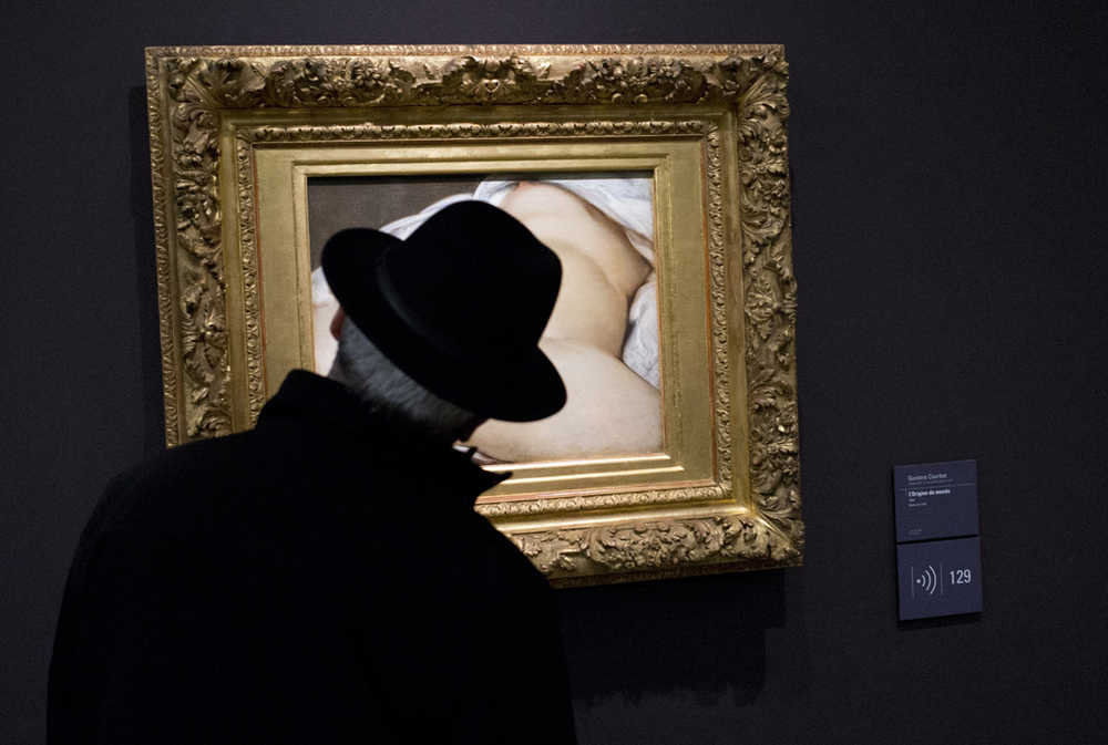 A visitor looks at Gustave Courbet's 1866 "The Origin of the World," which depicts female genitalia, on Friday at Orsay museum in Paris, France.