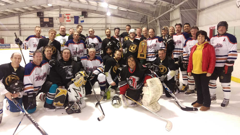 Juneau Old Timers and the Whitehorse Knights pose together at the Treadwell Ice Arena.