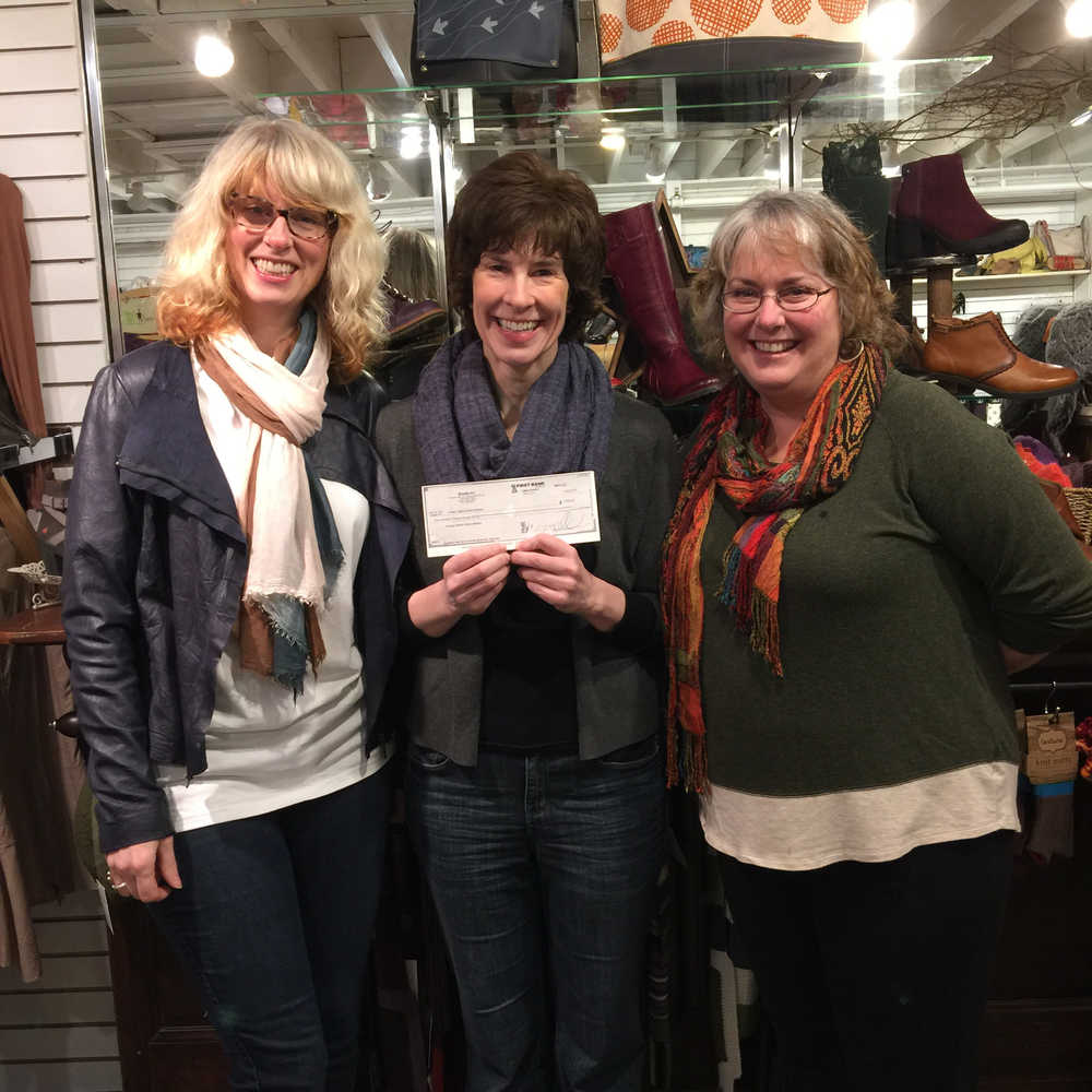 JAMM receives a check from Small Shops Give!