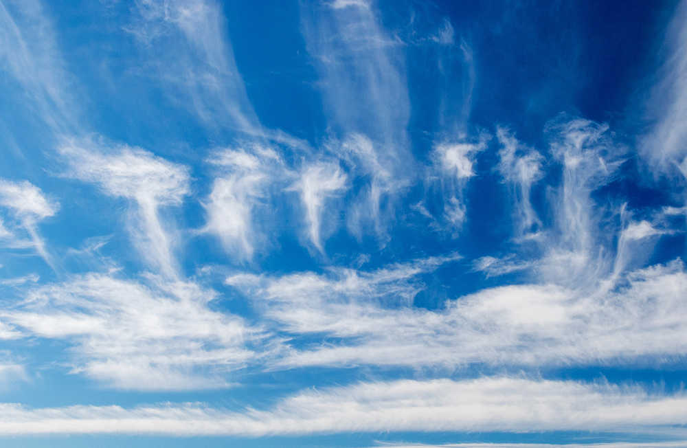 Wind-swept clouds float by. Photo by Kerry Howard.