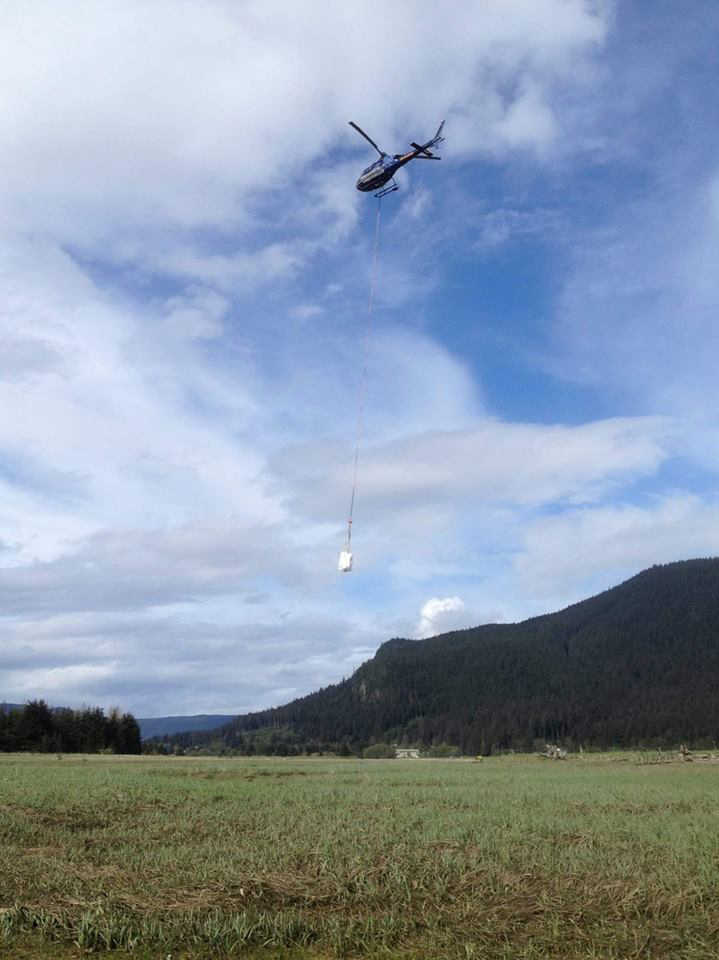 NorthStar Trekking helicopter hauling a sling of garbage.