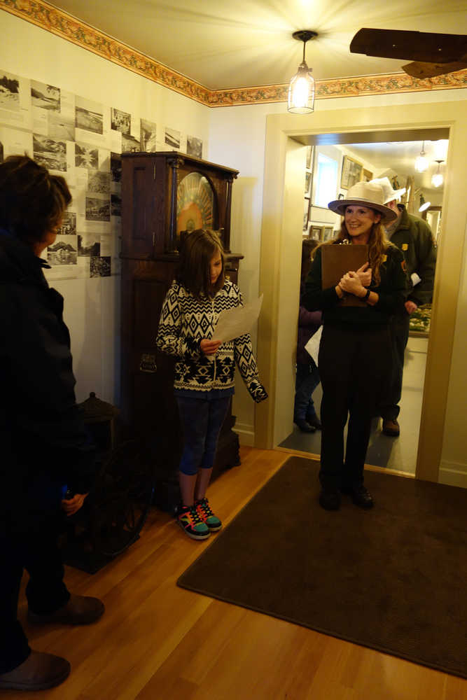 A Skagway School fourth-grader tells visitors about a coffee grinder in the Jeff Smith's Parlor Museum on Saturday, April 30.