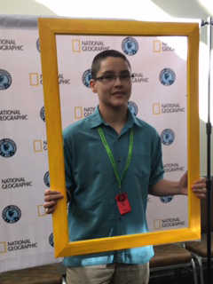 Ben Ng poses with frame at the Geo Bee.