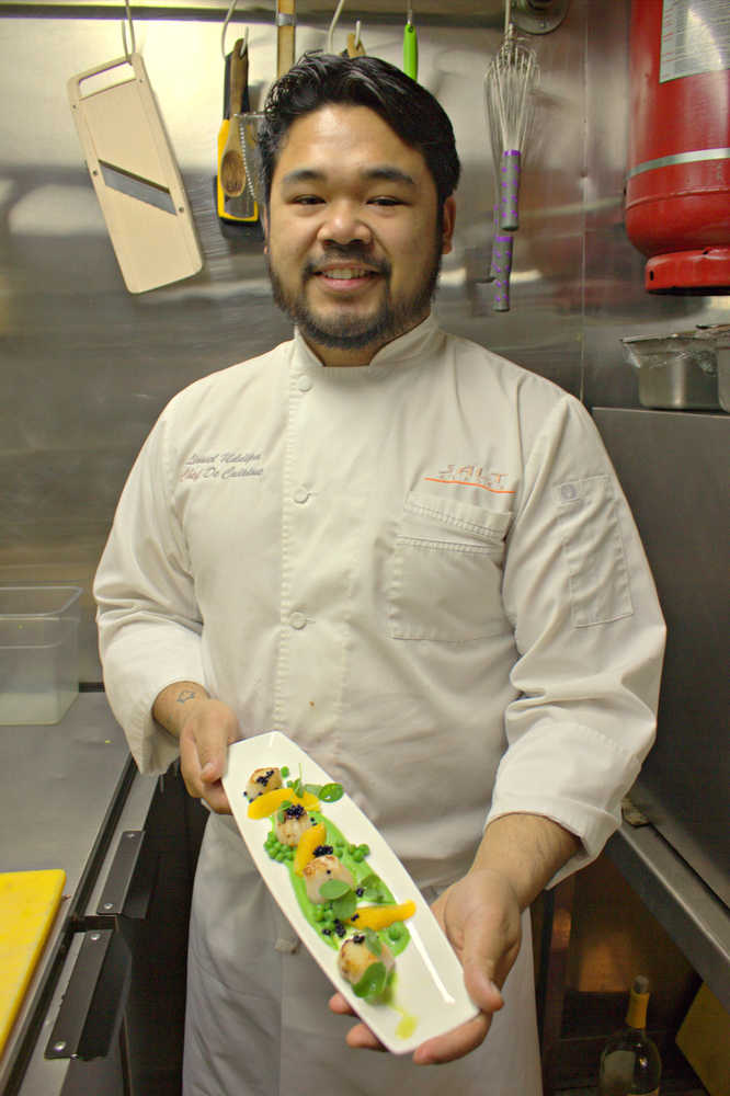 Chef Lionel Uddipa, who works his magic at SALT in Juneau, shows off his Alaskan scallops with pea puree.