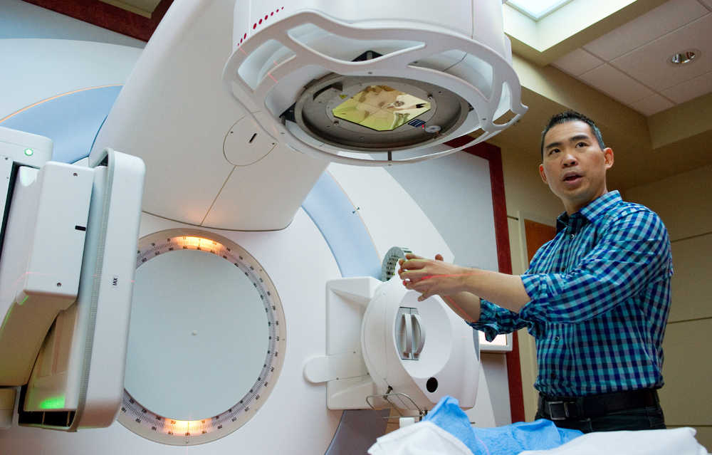 Dr. Eugene Huang, fulltime physician of the Southeast Radiation Oncology Center in Juneau, explains how they target cancer cells with radiation beamed from a linear accelerator at their center in October 2014.