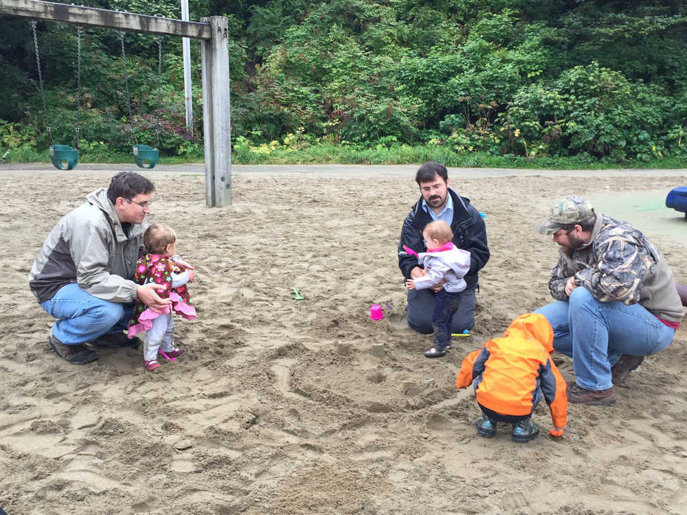 Dad's "dig" the Parents As Teachers program at a monthly parent Group Connection at Sandy Beach.  From left to right: Jon with Freyja Weaver, Shay with Novella Wilson and Ben with Cooper Peyerk.