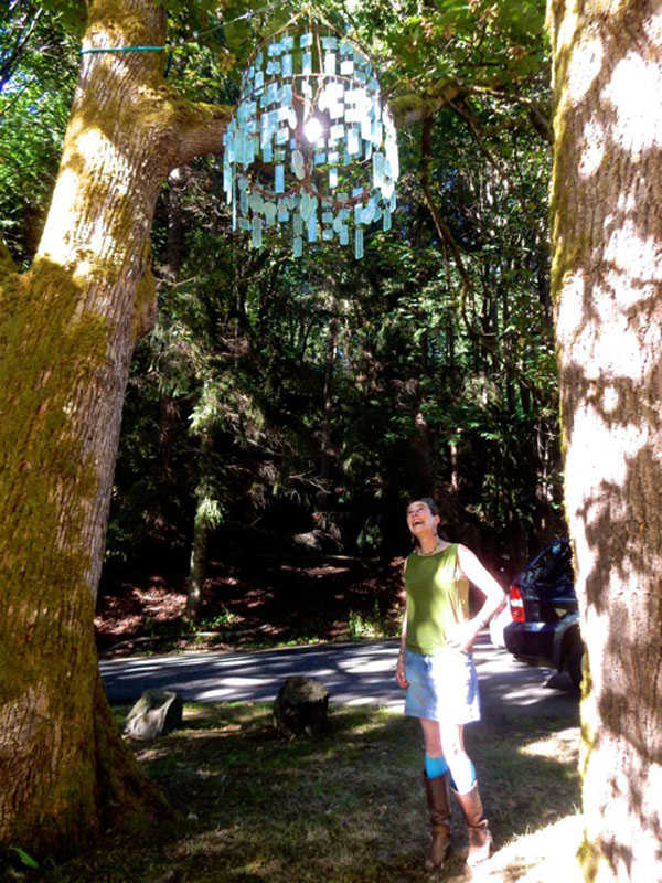 Juneau artist Rachael Juzeler's "Alder in the Rain [summer]" is on display in the Outdoor Art Exhibit at Carkeek Park "Heaven & Earth VIII" in Seattle. Here is the artist with her work.