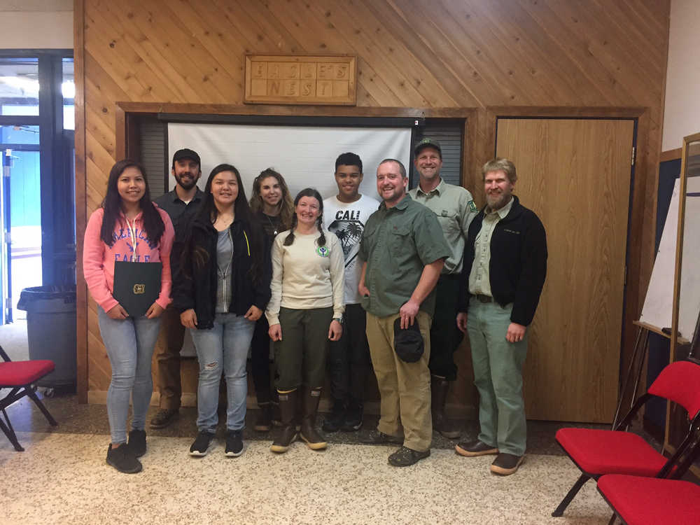 From left to right: Desire Jamestown, Angoon YCC member; Mitch Brooks, Hecla-Greens Creek Environmental Engineer; Dixie George, Angoon YCC member; Edie Leghorn, SEACC partner and YCC Crew Work Leader; Chrissy Post, USFS Wilderness Ranger; Kevin Mitchell, Angoon YCC member; Jared Williams, Angoon High School teacher and Angoon YCC Crew Supervisor; Kevin Hood, USFS wilderness program manager; Chad VanOrmer, Admiralty Island Monument Ranger.  Ceremony took place  Friday, Oct. 21 at Angoon High School.