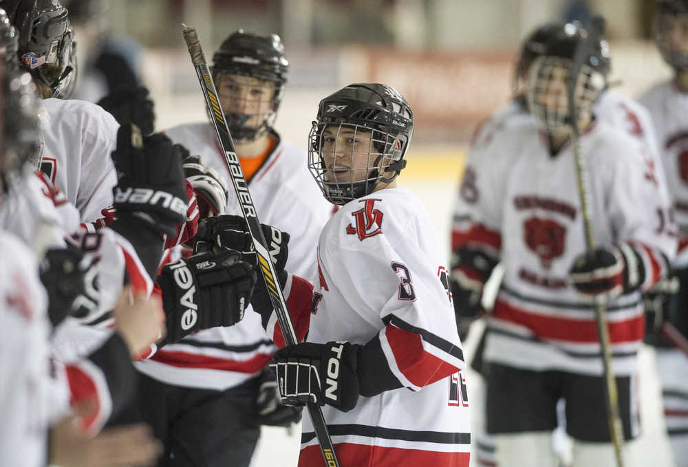 Juneau-Douglas' Cameron Jardell celebrates a goal against Hutchison High School at Treadwell Arena on Friday, Nov. 18, 2016.