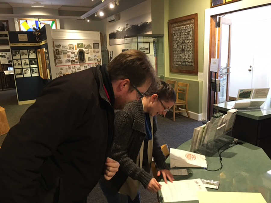 Curator of Collections Jodi DeBruyne and James Brooks go over the paperwork related to a donation of legal marijuana to the Juneau-Douglas City Museum.