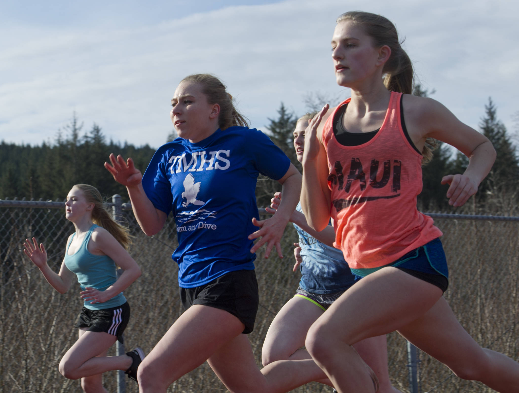 Members of the Thunder Mountain High School track and field team practice at TMHS on Thursday, April 13, 2017. (Michael Penn | Juneau Empire)