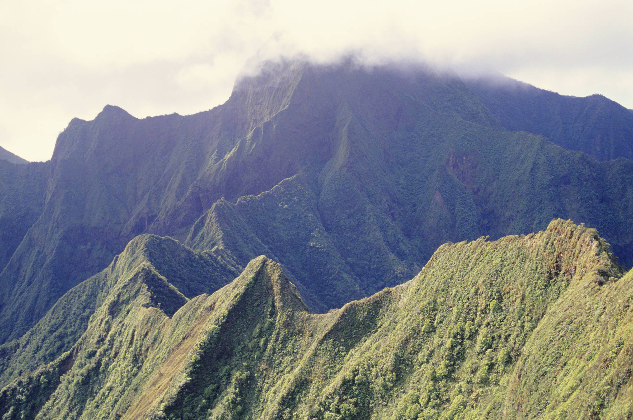 Mountainous peak in clouds (Thinkstock)