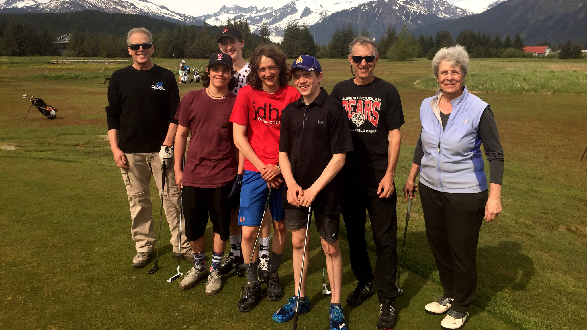 The Juneau Junior Golf Club poses on the first green of the Mendenhall Golf Course. The club is recruiting youth ages 12-18 to its summer program that introduces the skills, rules and etiquette of golf to beginners. Left to right: Tom Daugherty, Henry Davis, Cody Mitchell, Arna Ellefson-Carnes, Connor Norman, Guy Thibodeau and Diane Mayer. (Nolin Ainsworth | Juneau Empire)
