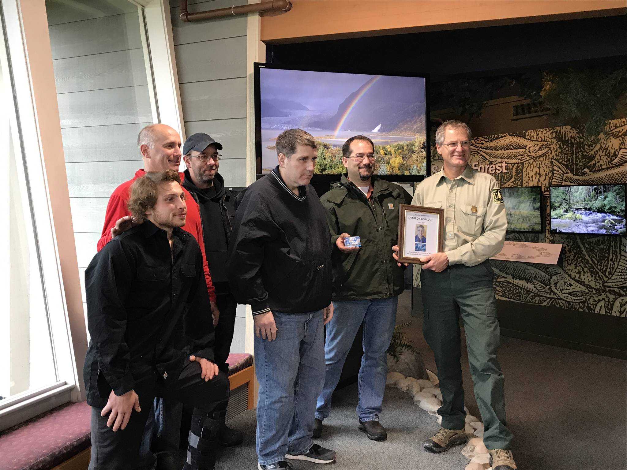 From left, Talon Lobaugh, Brick Lobaugh, Dale Lobaugh, Timber Lobaugh and Skiff Lobaugh receive a commemorative gift from Mendenhall Glacier Visitor Center Director John Neary. (Courtesy photo)