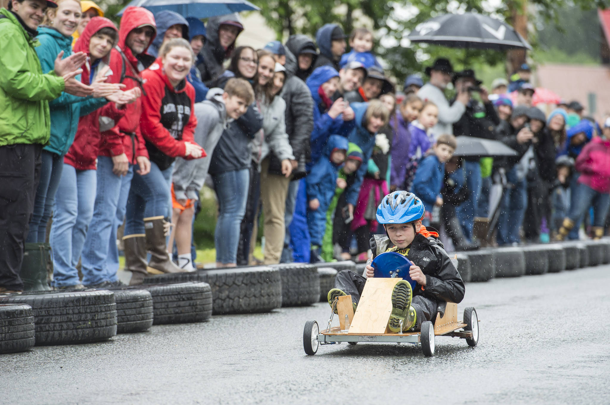 Owen Leighty, 7, makes his soapbox derby run during the 4th of July activities in Douglas on Tuesday, July 4, 2017. (Michael Penn | Juneau Empire)