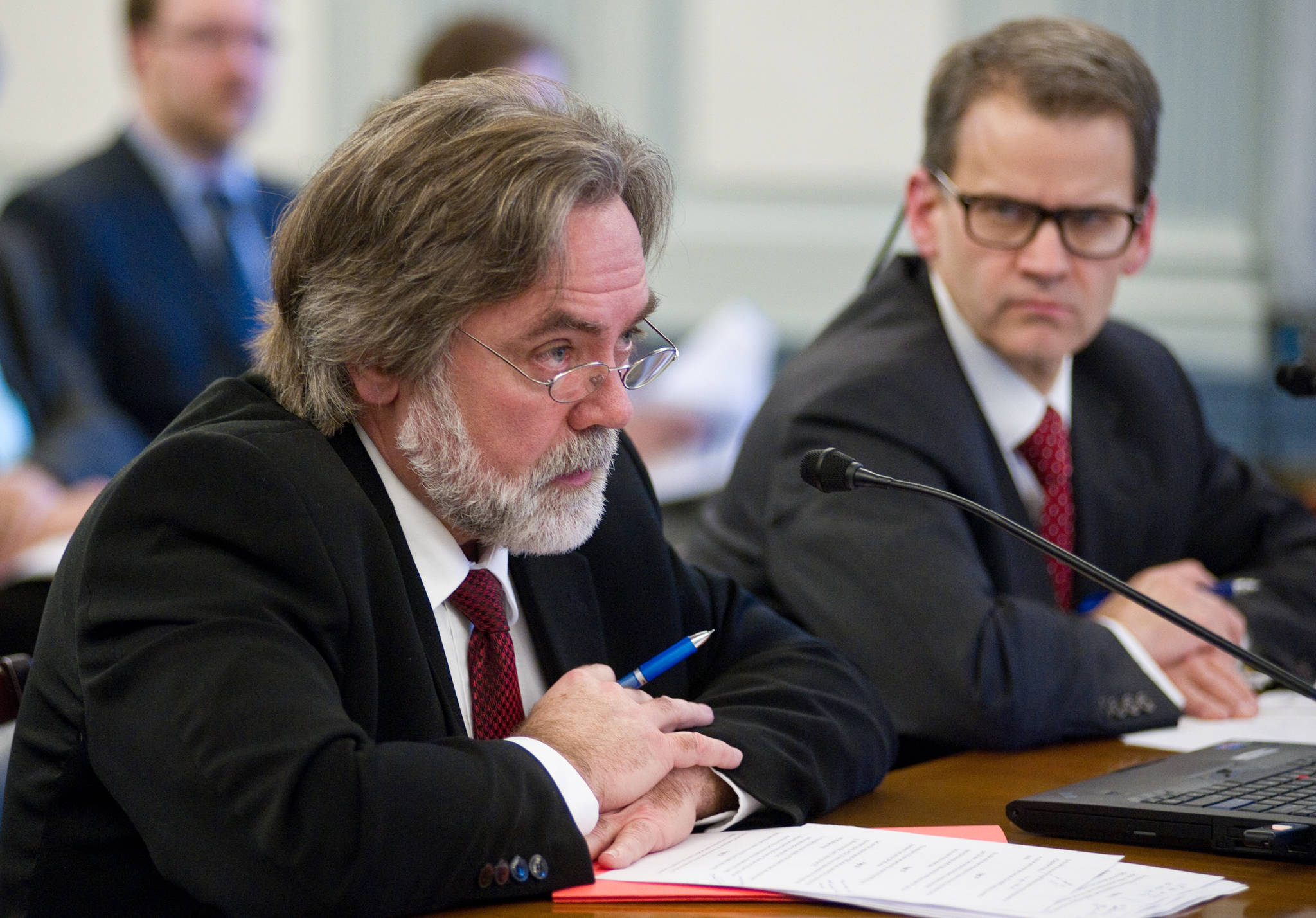 Sheldon Fisher, right, will replace Randall Hoffbeck, left, as commissioner of the Alaska Department of Revenue. Here, they are seen in 2015 discussing the Public Employees’ Retirement System (PERS) and the Teachers’ Retirement System (TRS) with the Alaska Legislature. (Michael Penn | Juneau Empire file)