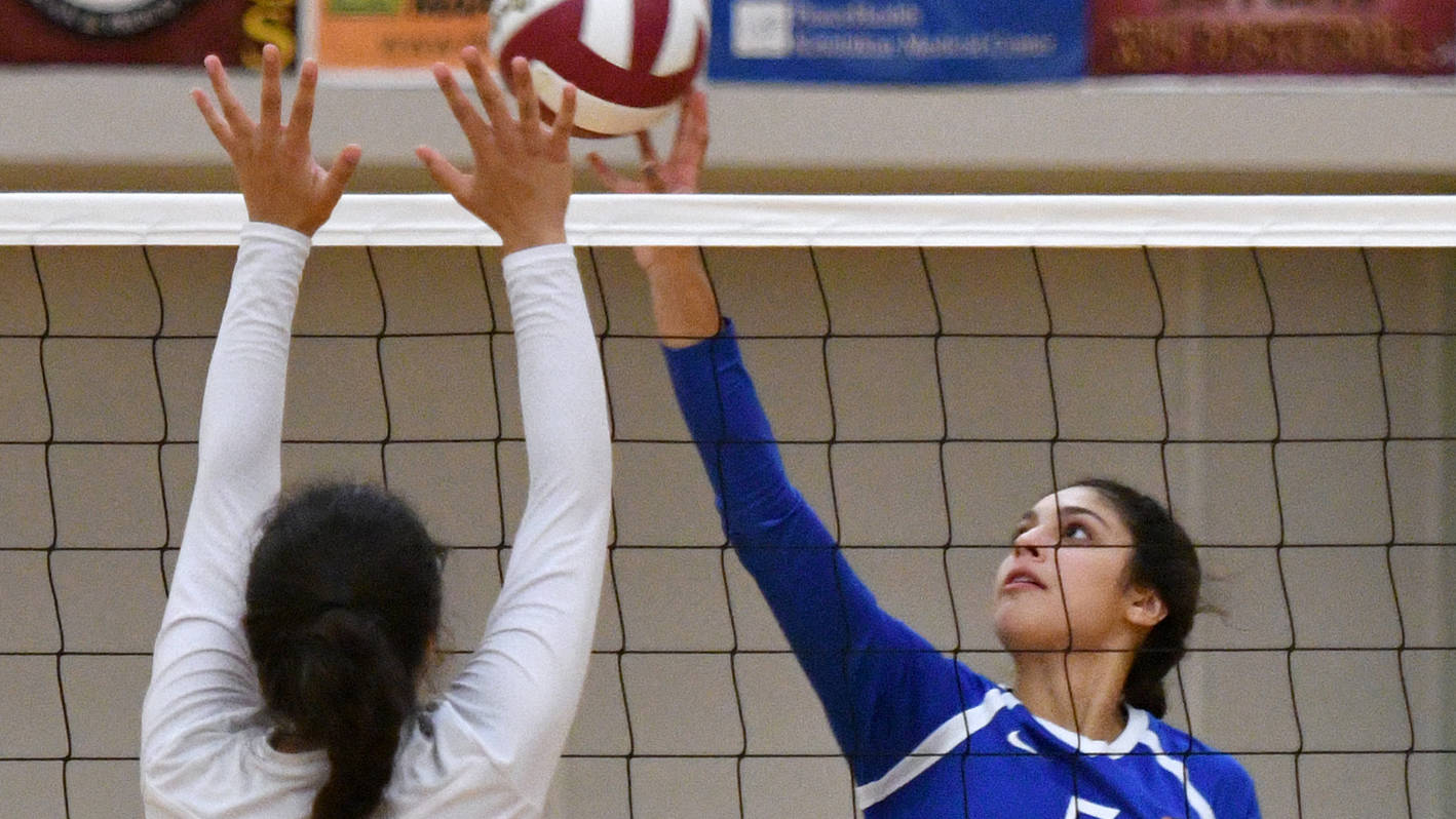 Thunder Mountain High School’s Maxie Saceda-Hurt tips the ball over the net, Friday, Sept. 8, 2017, during the Falcons’ 3-0 win against Ketchikan High School in the Clarke Cochrane Gym. The Falcons rematched the Kings on Saturday night. (Taylor Balkom | Ketchikan Daily News)