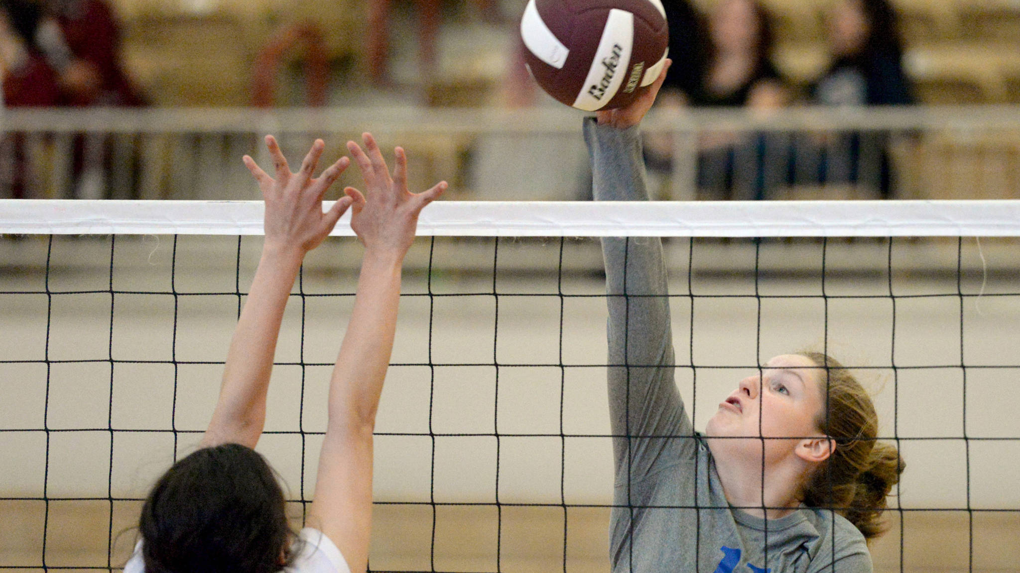 Thunder Mountain High School’s Audrey Welling spikes the ball over the net earlier this season during a jamboree in Ketchikan. (Taylor Balkom | Ketchikan Daily News)