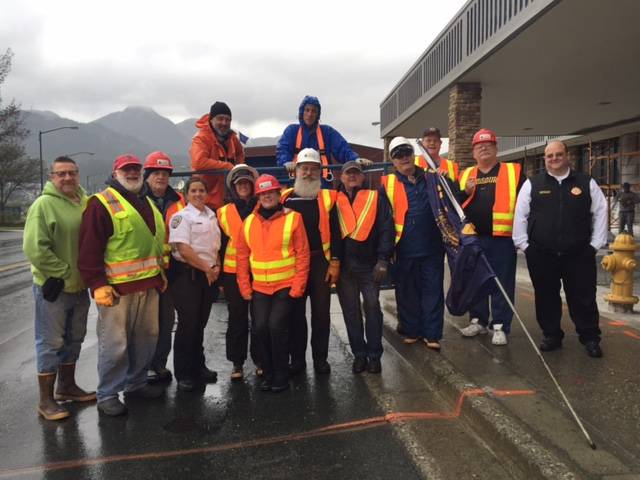 The Friends of the Flags removed the flags once again from Egan Drive on Saturday, Sept. 24, 2017. Pictured above are: top row from left to right: George Fisher and Don Beard. Bottom row: Tom Gill, Eric Peter, Jim Carroll, Officer Rebecca Notmeyer, Anna Schovaers, Donna Fox Page, Jon Peterson, Dan Kenkec, Jeff Stein, Brad Waldron, John Rock, Chad Cameron. Thanks to Tyler Rental for the use of the lift. (Photo courtesy of Jeff Stein)