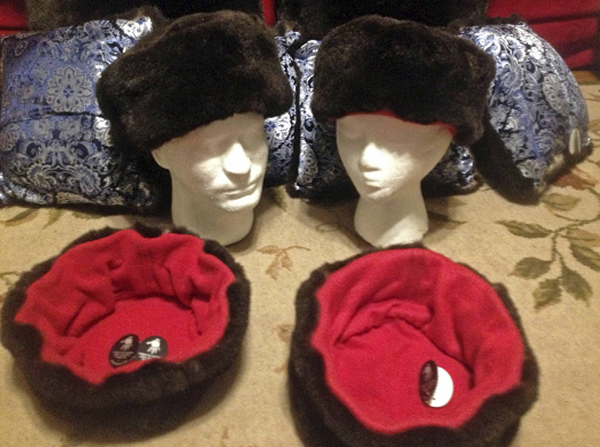 This undated photo shows hats trimmed with sea otter fur, offered by Alaska Native Marcus Gho’s Tuvraqtuq online retail store based in Juneau. (Marcus Gho via AP)