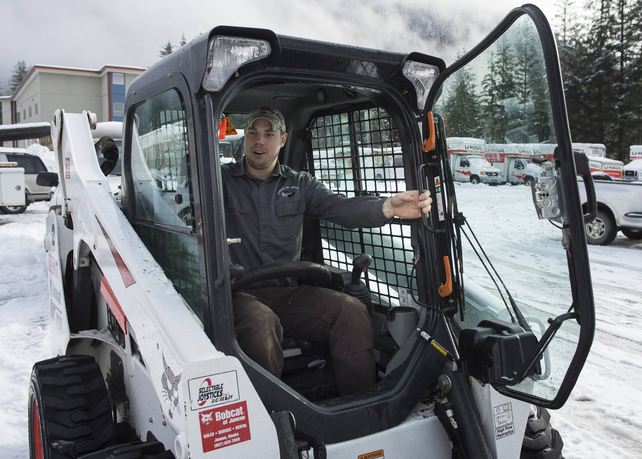 Colter Boehm, service manager for Bobcat of Juneau, works in his company’s yard on Friday, Feb. 23, 2018. (Michael Penn | Juneau Empire)