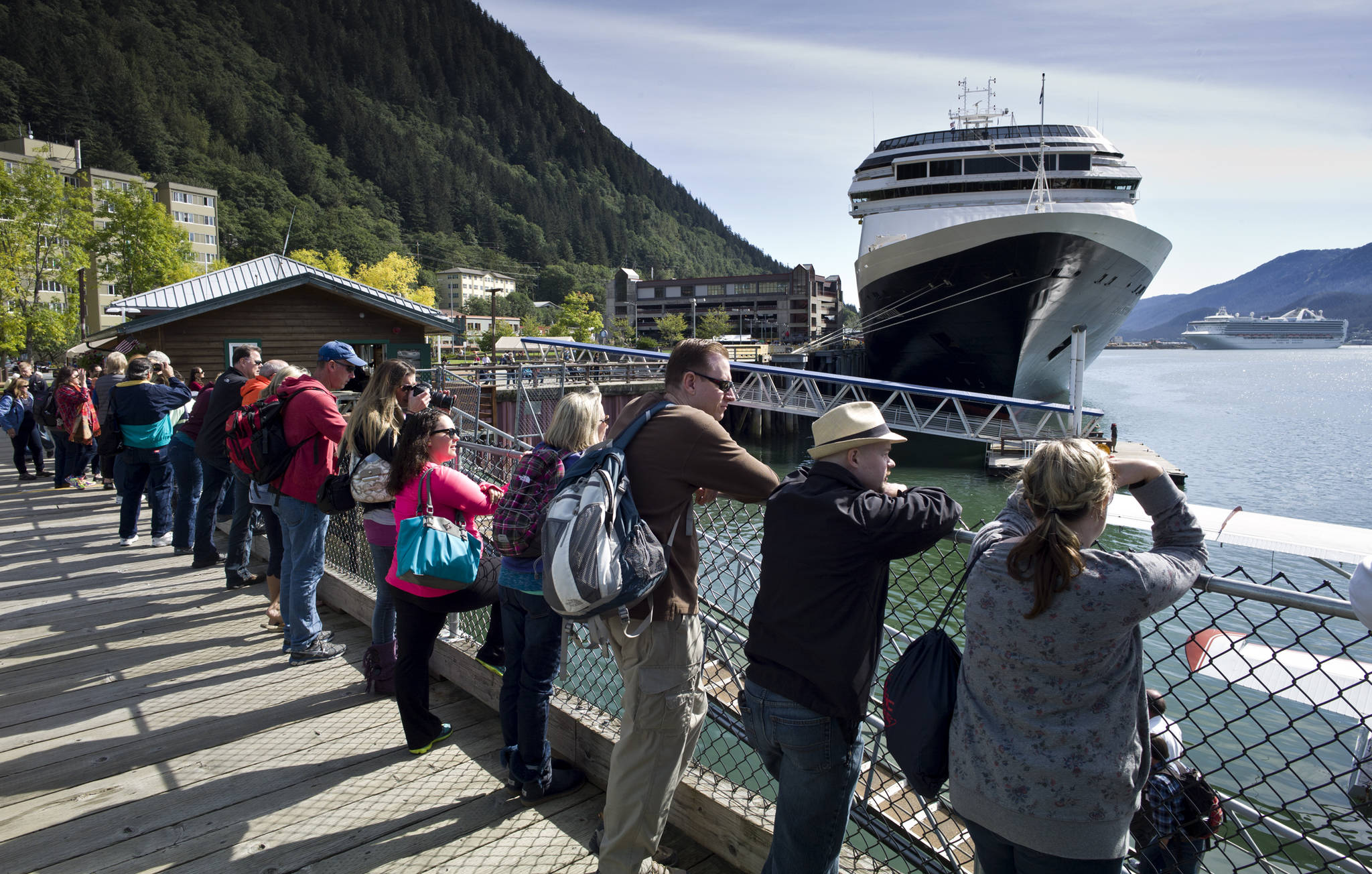In this August 2015 photo, visitors line up to view Juneau’s downtown harbor. (Michael Penn | Juneau Empire File)