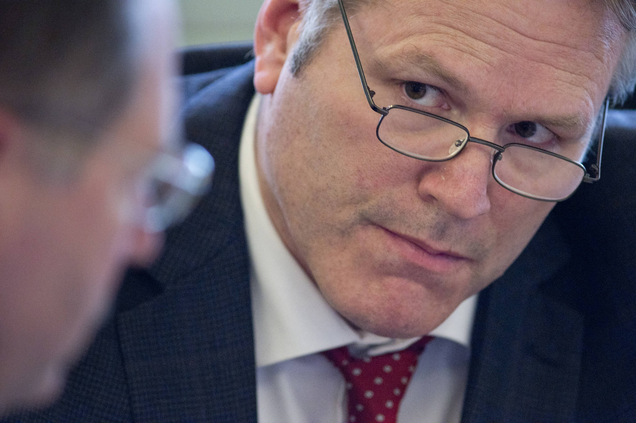 In this April 2017 photo, Sen. Mike Dunleavy, R-Wasilla, right, listens to David Teal, fiscal analyst for the Alaska Legislature, during a Senate Finance Committee meeting at the Capitol. Sen. Dunleavy offered amendments to the operating budget bill to cut funding for public broadcasting and significantly reduced funding for the Alaska Marine Highway system. (Michael Penn | Juneau Empire File)