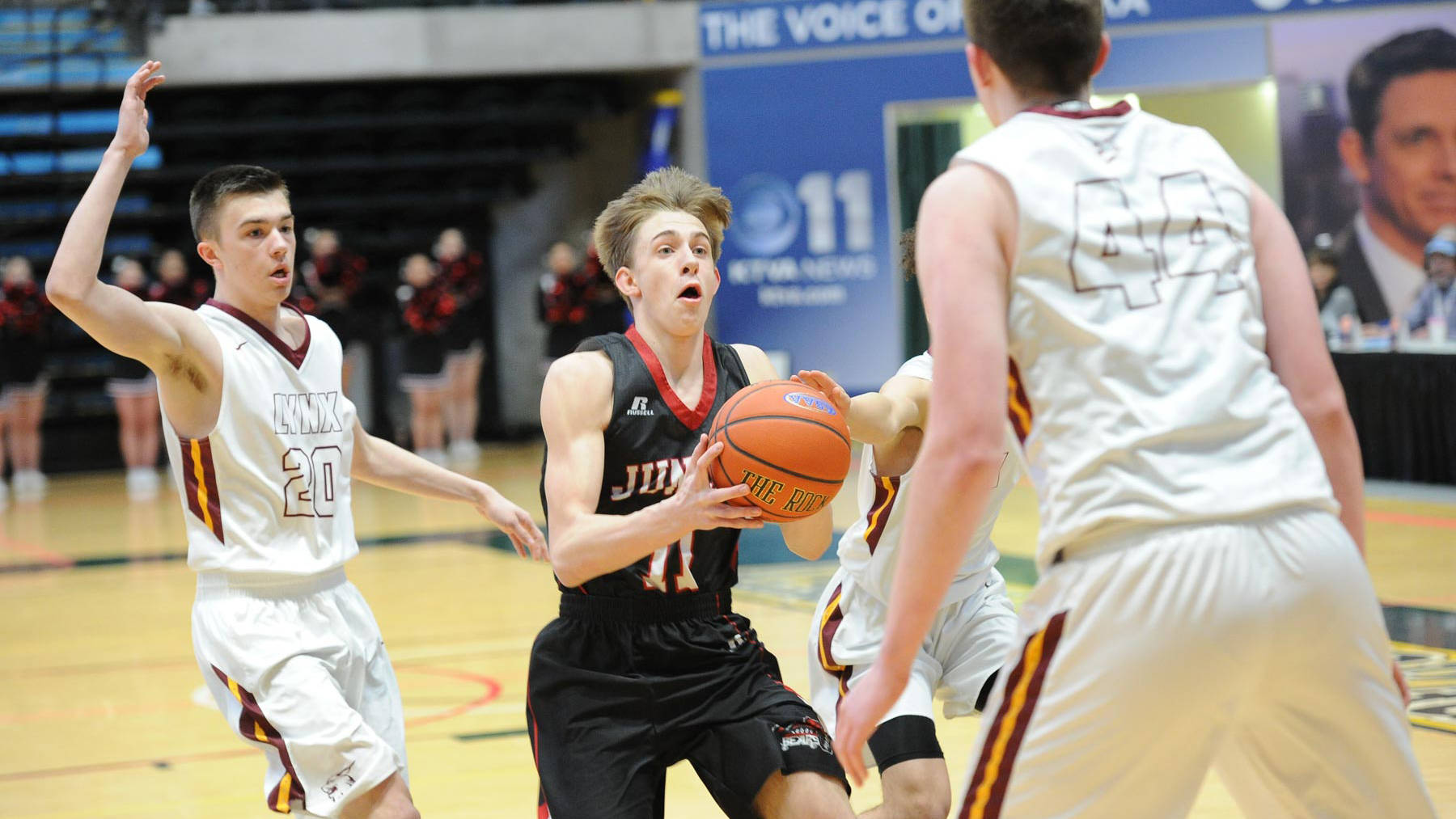 Juneau-Douglas’ Kolby Hoover drives during JDHS’ ASAA/First National Bank Alaska state basketball tournament game Thursday at the Alaska Airlines Center in Anchorage. (Michael Dinneen | For the Juneau Empire).