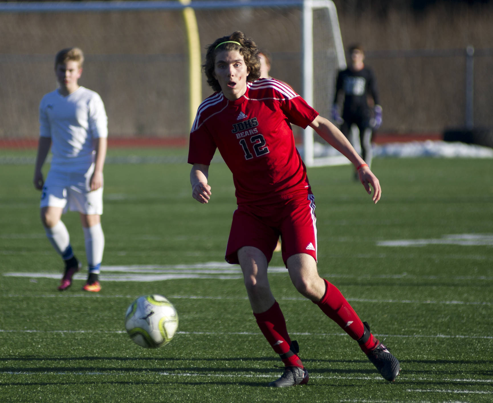 Juneau-Douglas’ Ronan Davies tracks the ball Wednesday evening at Thunder Mountain High School. JDHS defeated TMHS 5-0. (Richard McGrail | Juneau Empire)