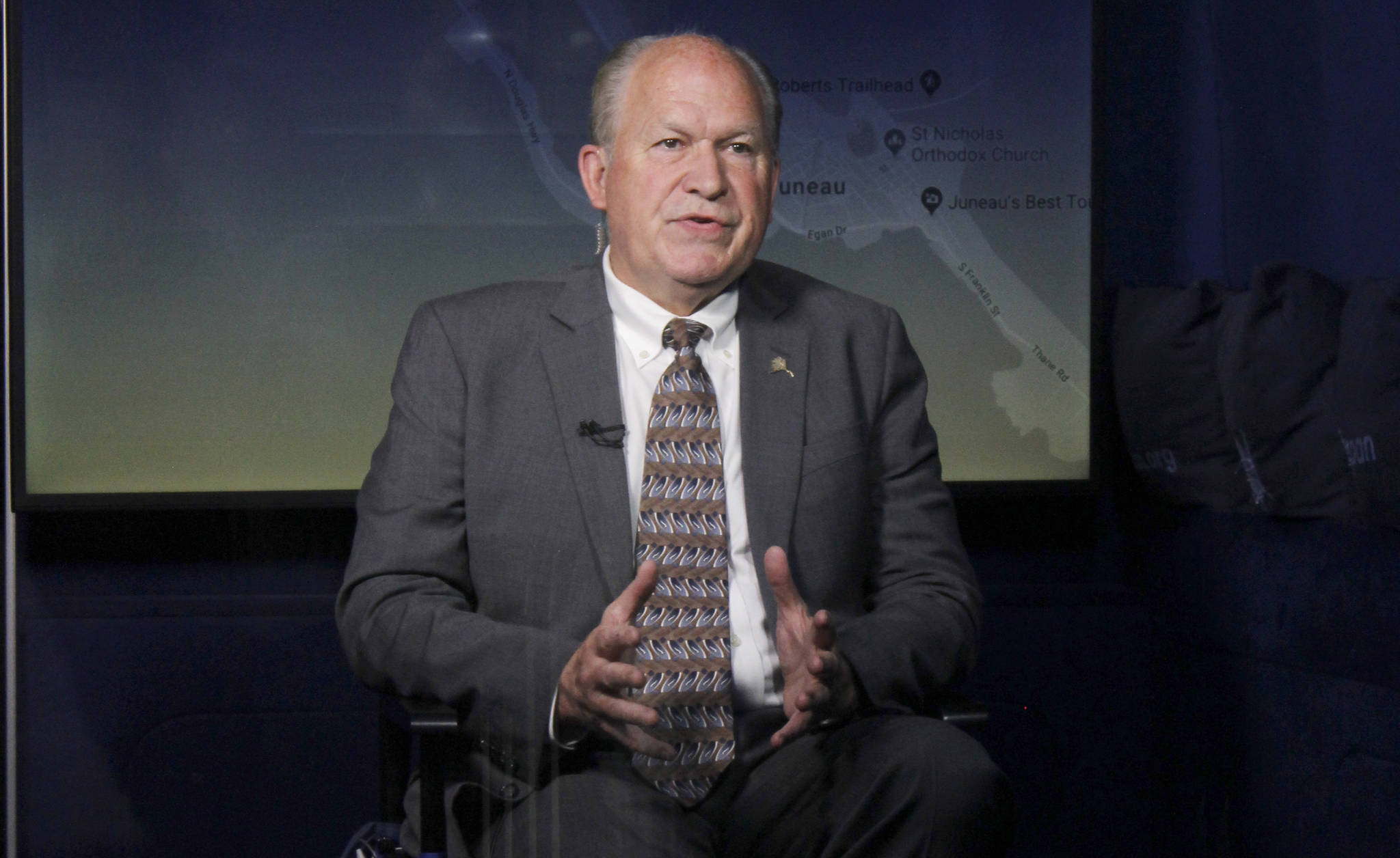 Gov. Bill Walker talks to C-SPAN host Peter Slen via webcam aboard a C-SPAN bus in Juneau on Monday, June 18, 2018. (Alex McCarthy | Juneau Empire)