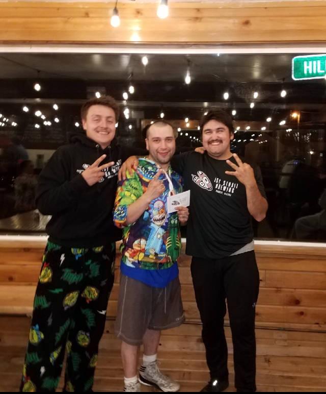 The top-three finishers of the first annual Hoonah Only Fools Run at Midnight, second place finisher Michael Croasmun, left, winner Wilbur Skeek, middle, and third-place finisher Nick Hughes. (Photo courtesy Paul Comolli)