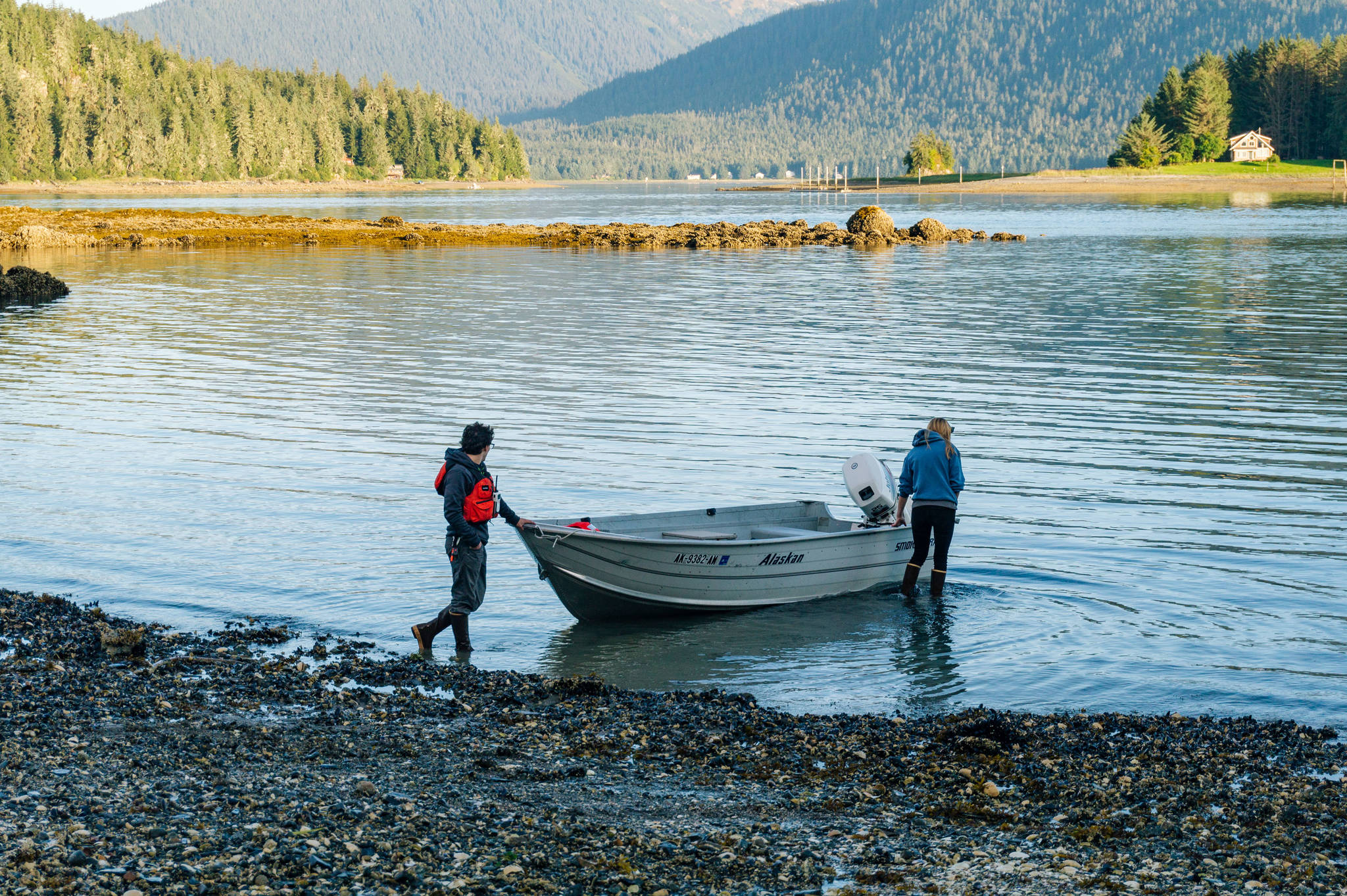 Keagan on the left and Sarah on the right. Holding the boat off the rocks. (Gabe Donohoe | For Juneau Empire)