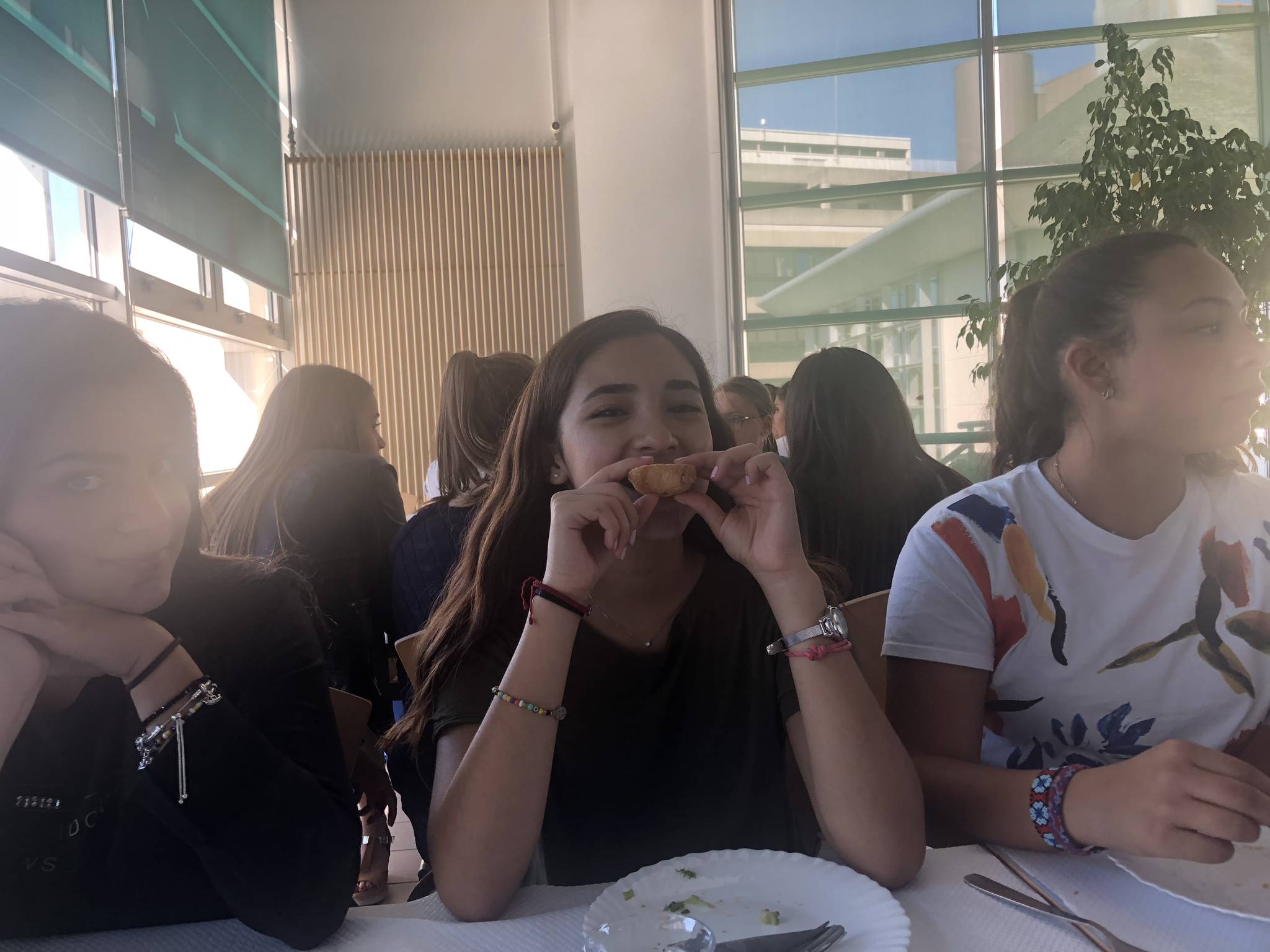 Alejandra, an exchange student from Mexico, posing with bread during lunch, Sept. 12, 2018. (Bridget McTague | For the Juneau Empire)