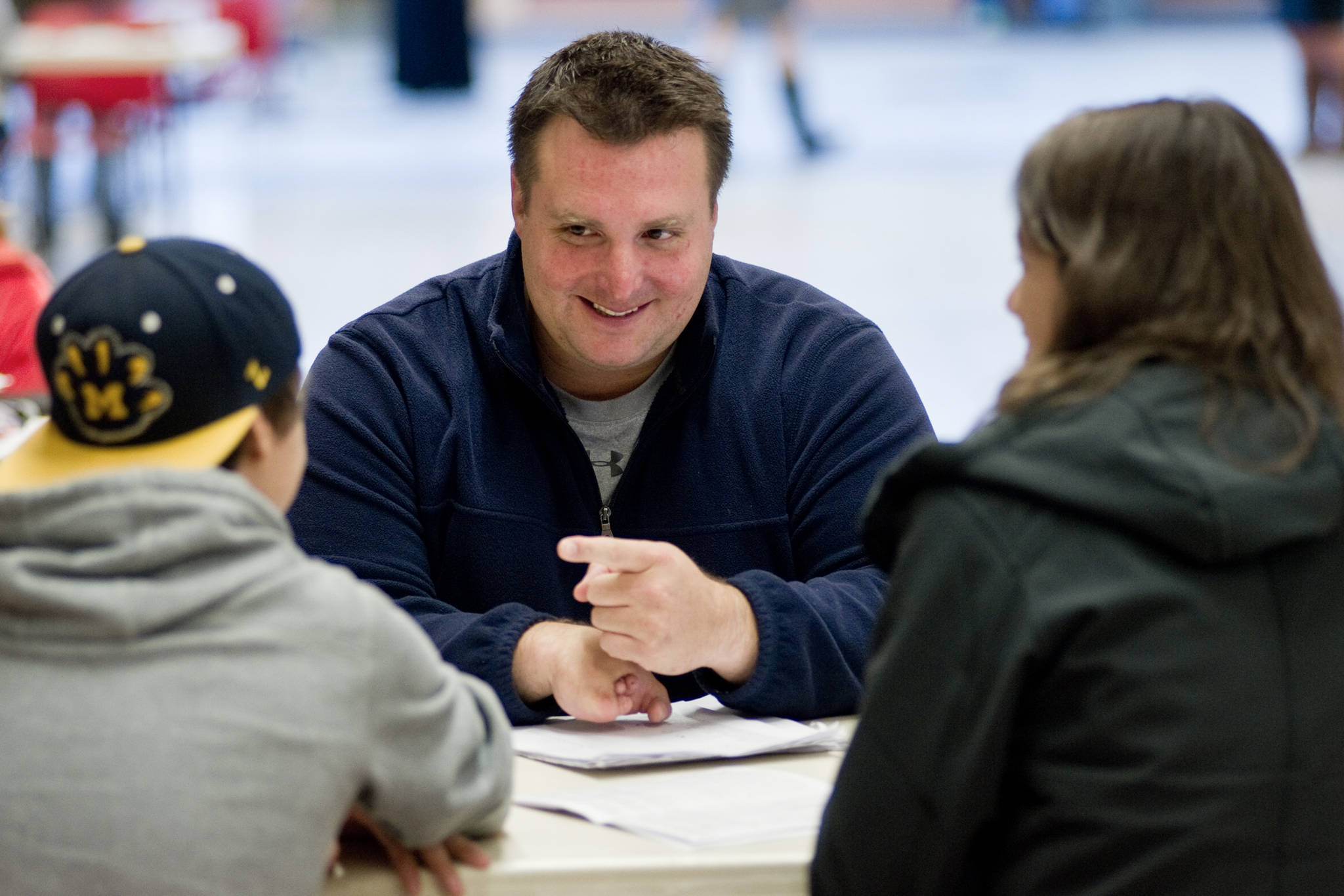 Chad Bentz, a physical education teacher at Juneau-Douglas High School holds a parent/teacher conference at JDHS in 2014. Bentz is a 1999 graduate of JDHS and baseball standout. (Michael Penn | Juneau Empire File)