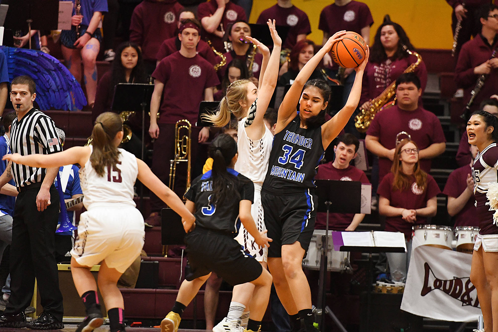 Thunder Mountain junior Kira Frommherz looks for a pass against Ketchikan senior Ashley Huffine during the opening round Region V 4A Tournament at the B.J. McGillis Fieldhouse in Sitka. (Dustin Safranek | Ketchikan Daily News)