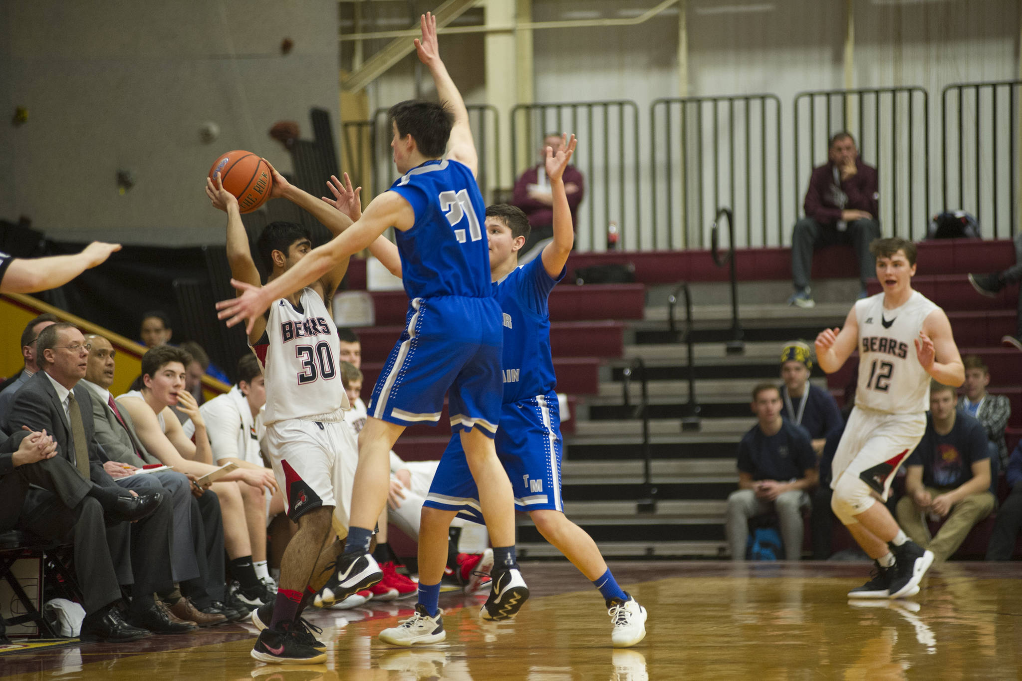 Juneau-Douglas’ Krishant Samtani is closely guarded by Thunder Mountain’s Braden Jenkins, left, and Oliver Mendoza against Juneau-Douglas in the Region V Basketball Tournament at B.J. McGillis Gymnasium in Sitka on Thursday, March 7, 2019. (Nolin Ainsworth | Juneau Empire)