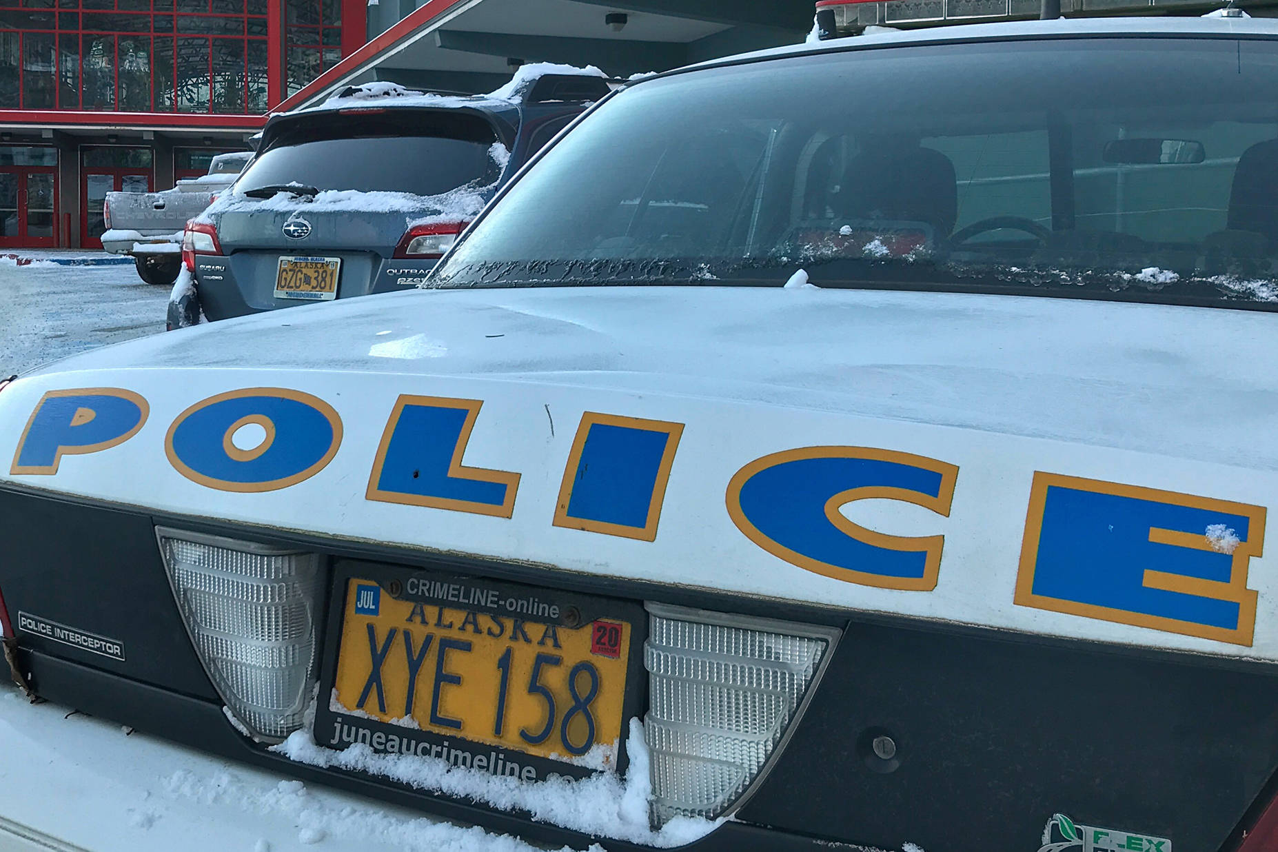 A Juneau Police Department car sits in front of Juneau-Douglas High School on Tuesday, Jan. 8, 2019. (Michael Penn | Juneau Empire)