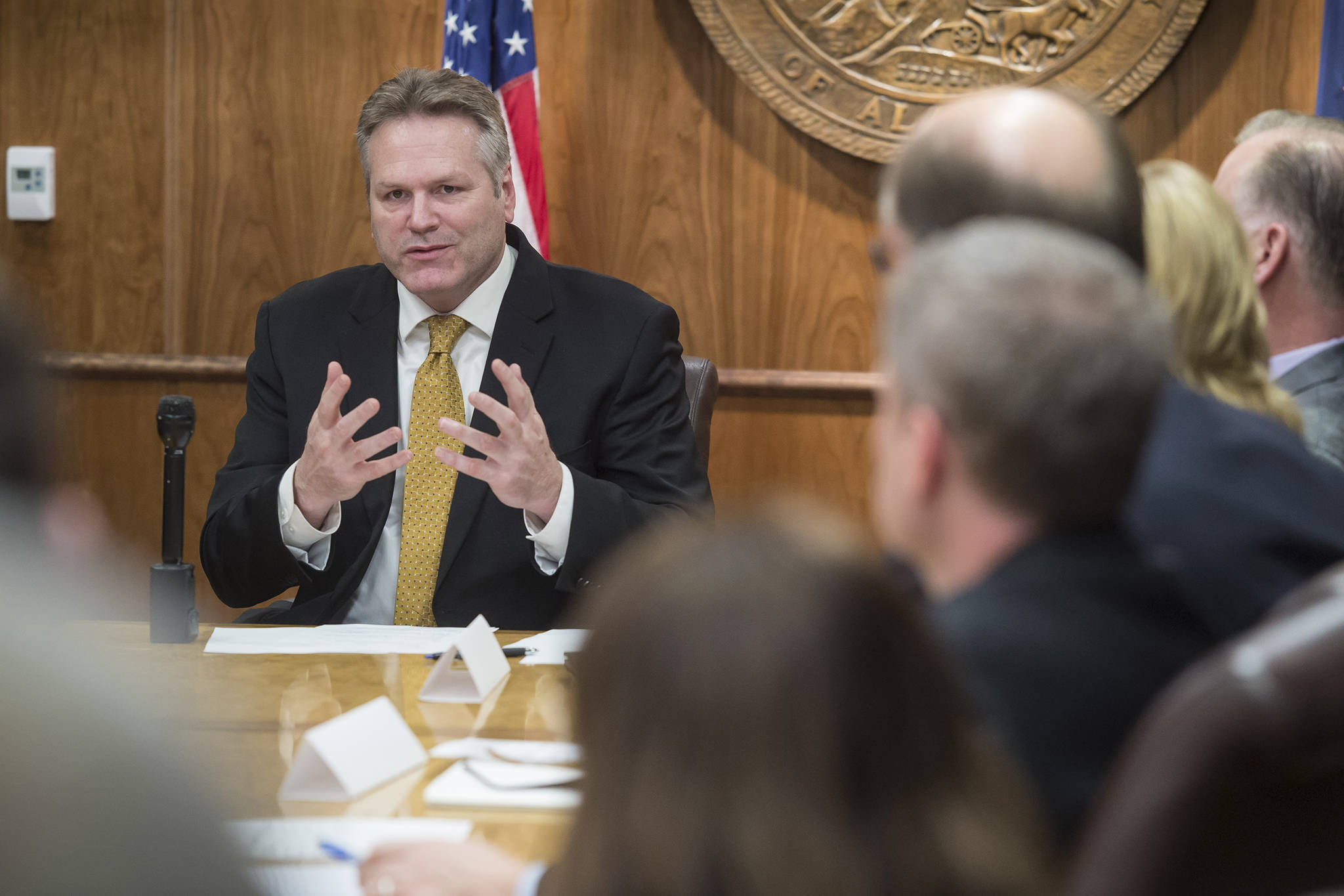 In this Jan. 8, 2019 photo, Gov. Mike Dunleavy meets with his cabinet members and gives attending media a list of his administration’s priorities at the Capitol. (Michael Penn | Juneau Empire File)