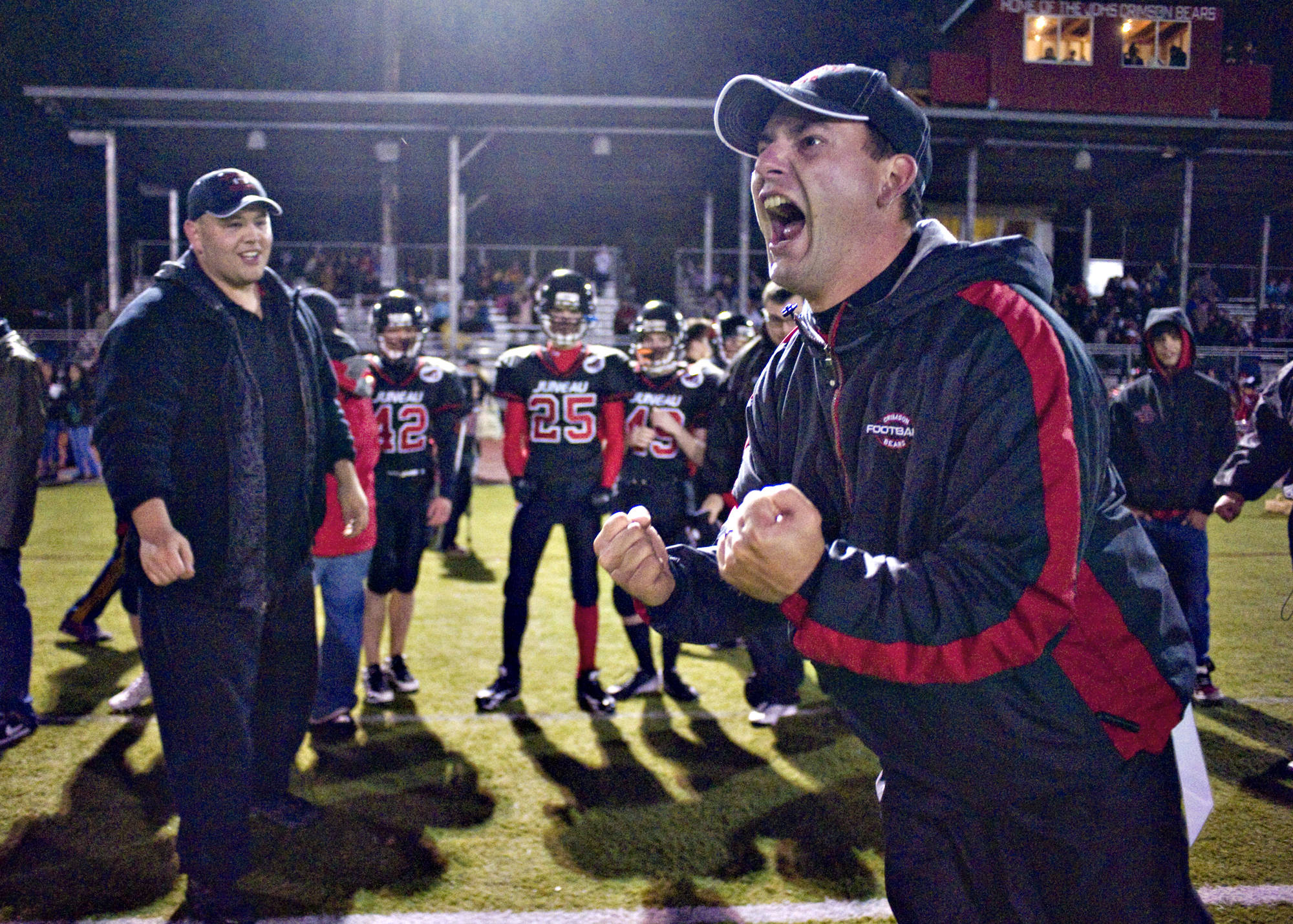 Former Juneau-Douglas football coach Rich Sjoroos celebrates after his team goes up against Chugiak in at Adair-Kennedy Memorial Park in 2010. (Michael Penn | Juneau Empire)