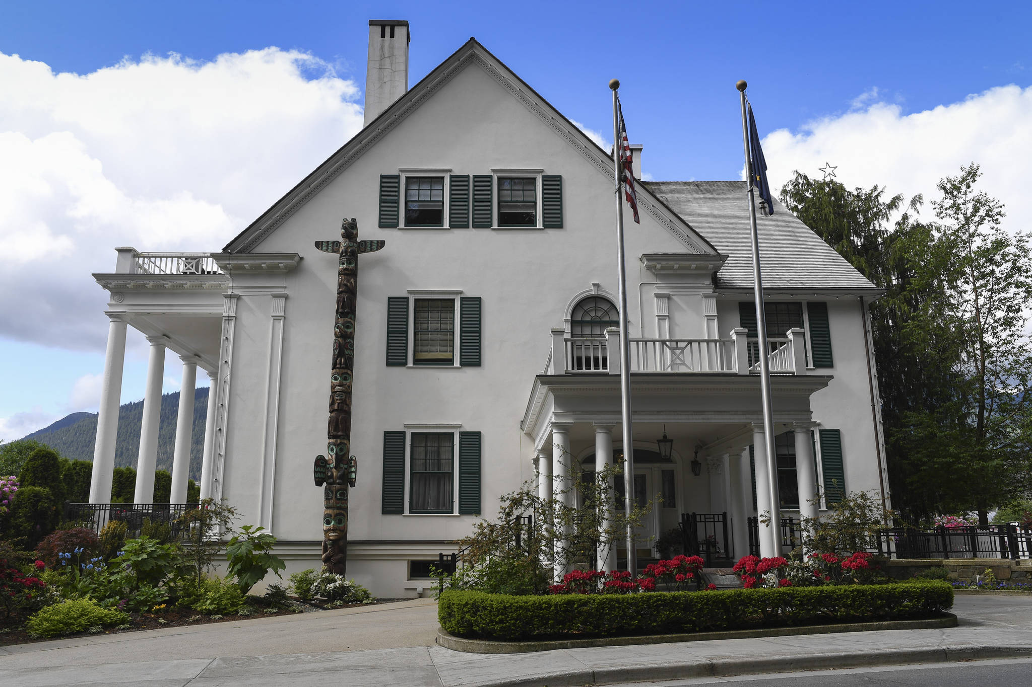 The totem at the Governor’s House is an example of totems carved by people employed by the Civilian Conservation Corps. (Michael Penn | Juneau Empire)