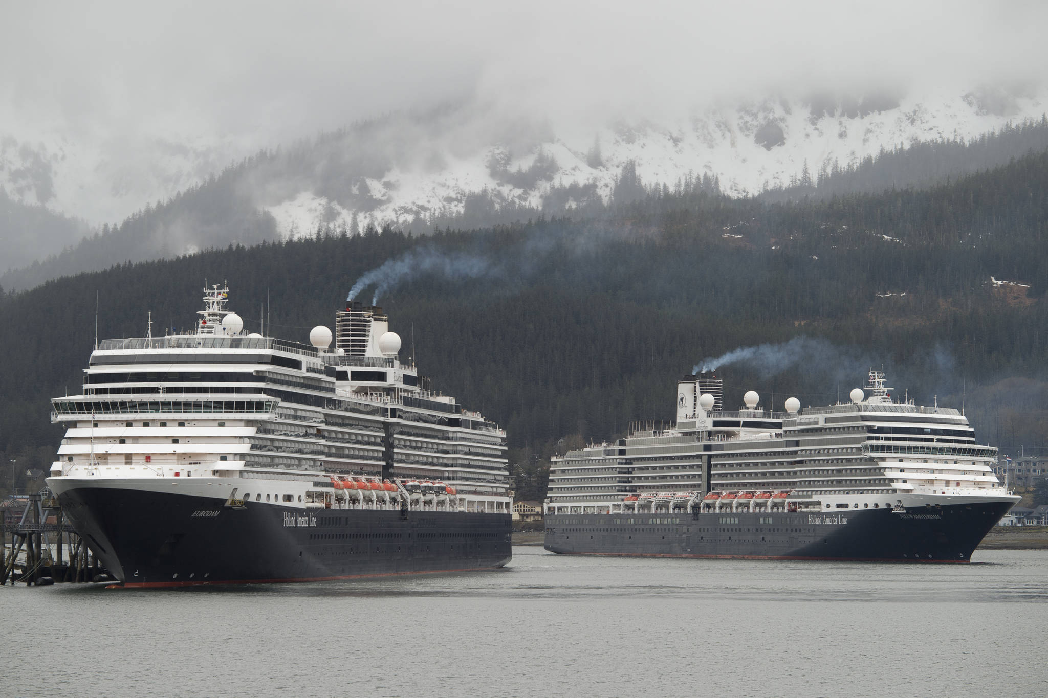 In this May 1, 2017 photo, the Holland America Line cruise ships Eurodam, left, and Nieuw Amsterdam pull into Juneau’s downtown harbor. Neither of these ships is the ship mentioned in the article. (Michael Penn | Juneau Empire File)