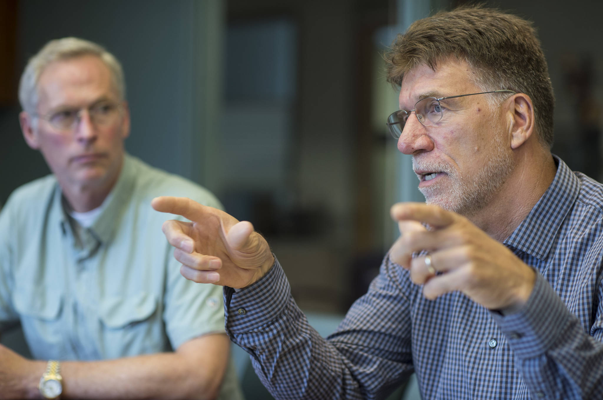 University of Alaska President Jim Johnsen, left, listens to Dr. Steve Atwater, Executive Dean of the university’s new Alaska College of Education, during an interview at the University of Alaska Southeast on Friday, August 3, 2018. (Michael Penn | Juneau Empire)