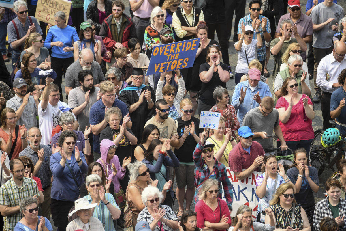 Hundreds attend a rally in front of the Capitol calling for an override of Gov. Mike Dunleavy’s budget vetoes on the first day of the Second Special Session of the Alaska Legislature in Juneau on Monday, July 8, 2019. (Michael Penn | Juneau Empire)